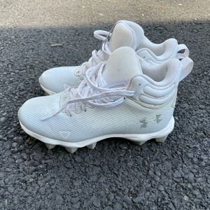 Kids under Armour football cleats worn one season. Size 2y.
